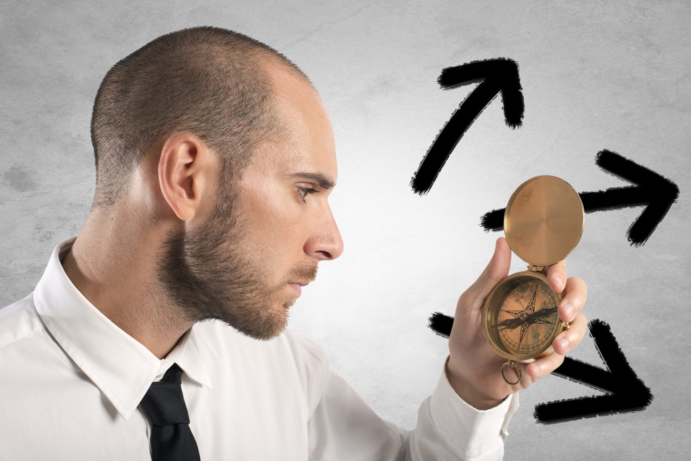 Concept,Of,Choose,The,Right,Way,With,Businessman,And,Compass