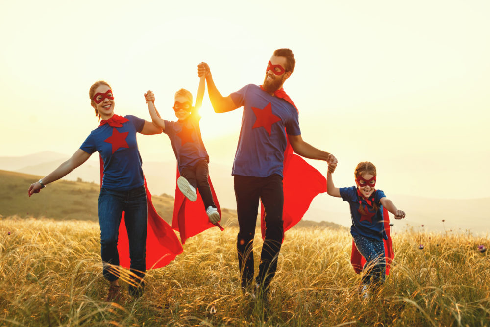 Concept,Of,Super,Family,,Family,Of,Superheroes,At,Sunset,In